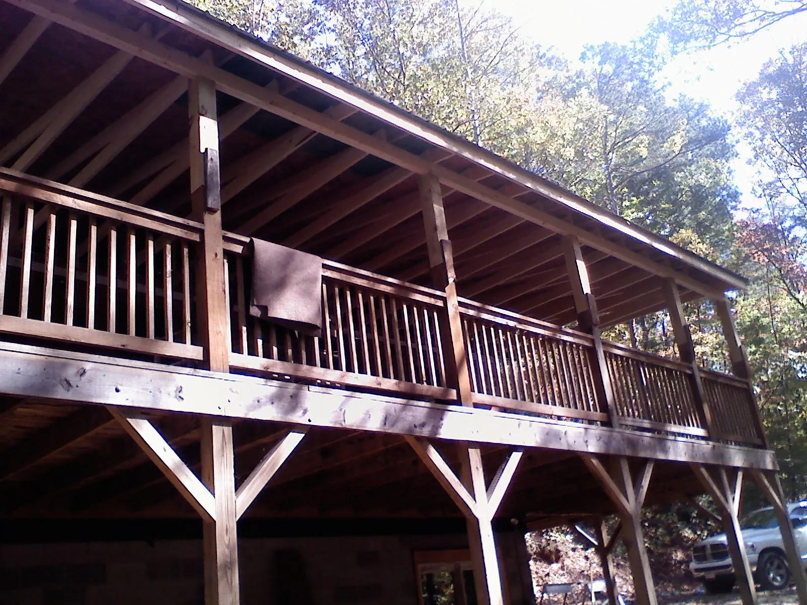 Timber framing under a new elevated porch and deck in Norris
